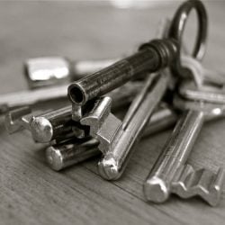 Tenant surrendered tenancy but refuses to return keys until possessions collected?