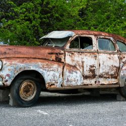 End of tenancy and derelict car on driveway